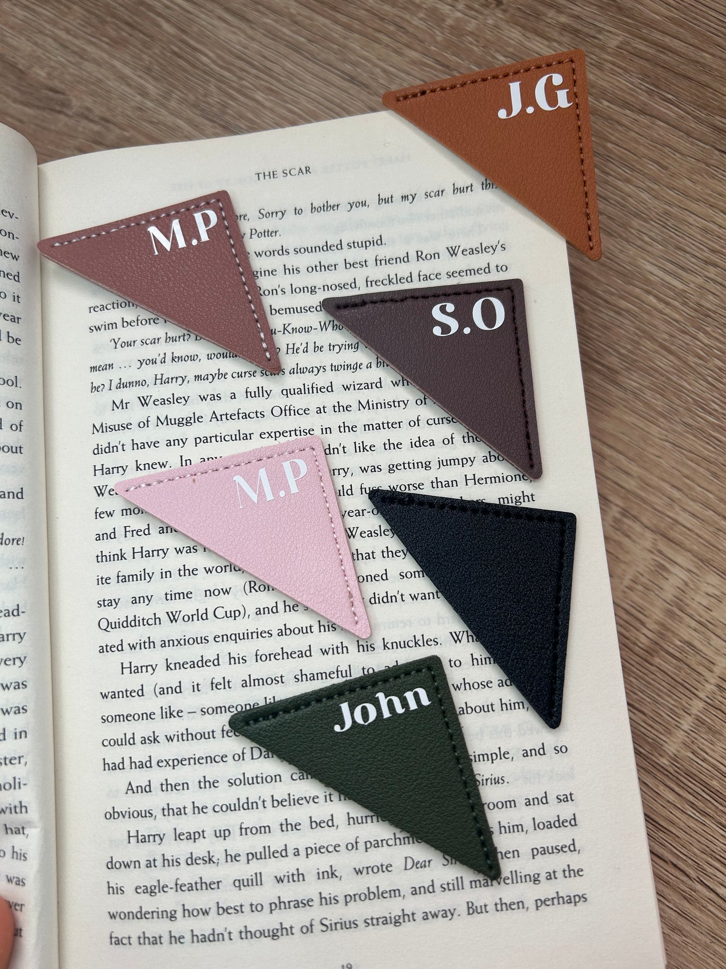 Triangular leather bookmark.