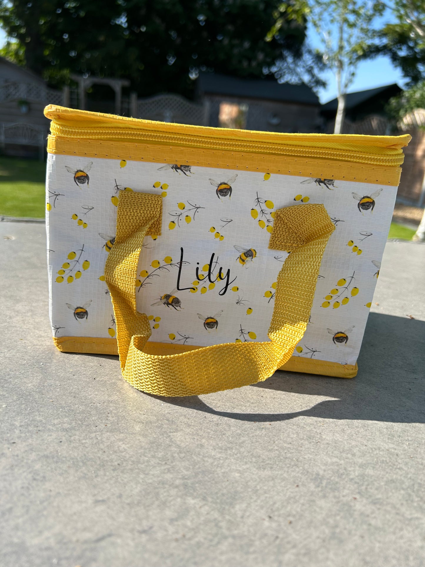 Bee and flower theme insulated lunch bag.