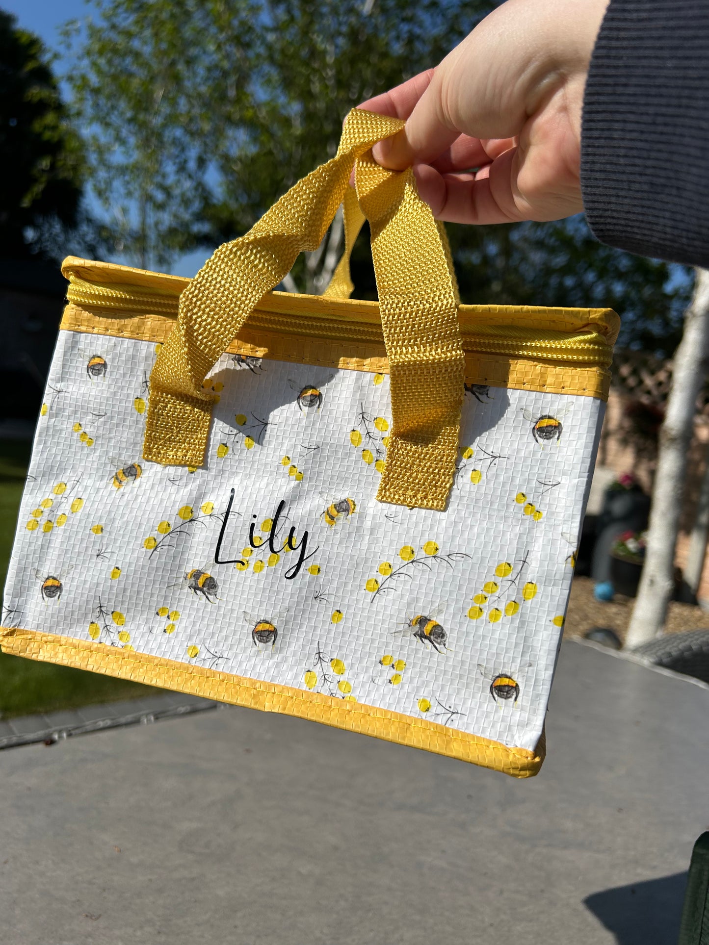 Bee and flower theme insulated lunch bag.