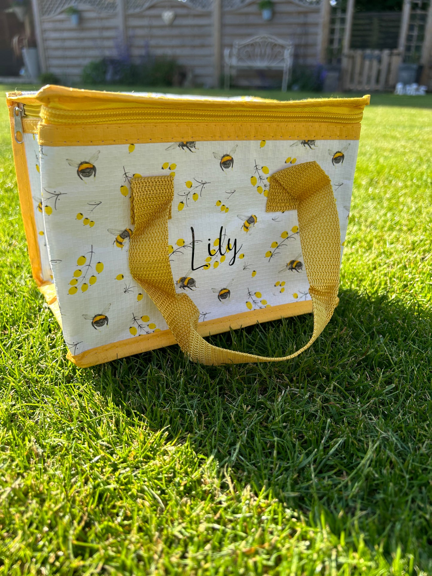 Bee and flower theme insulated lunch bag.