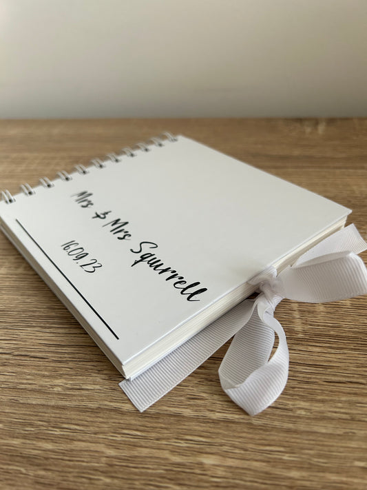 Glossy, wire bound guestbook.